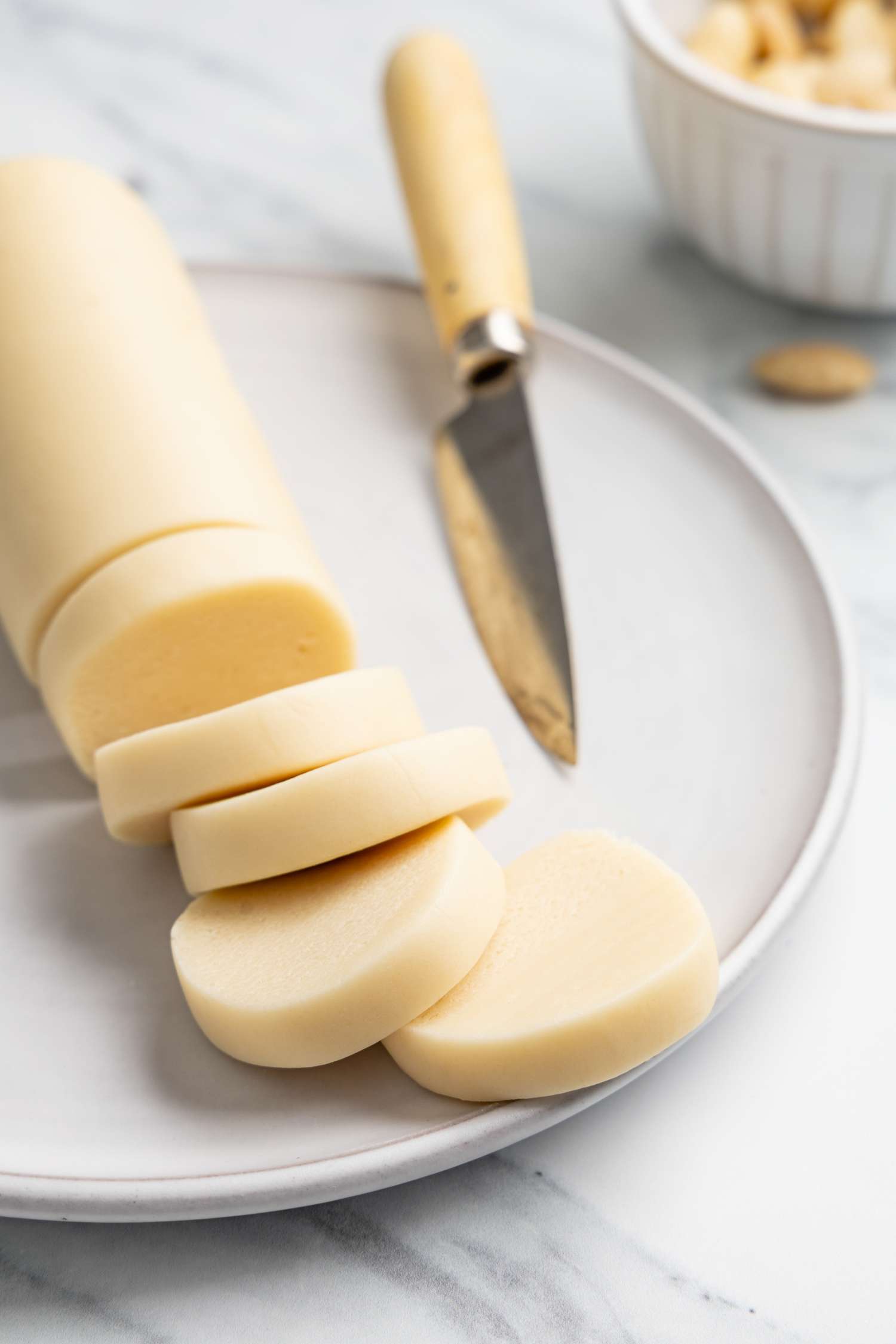 Log of Marzipan with Sliced Marzipan Disks Next to It