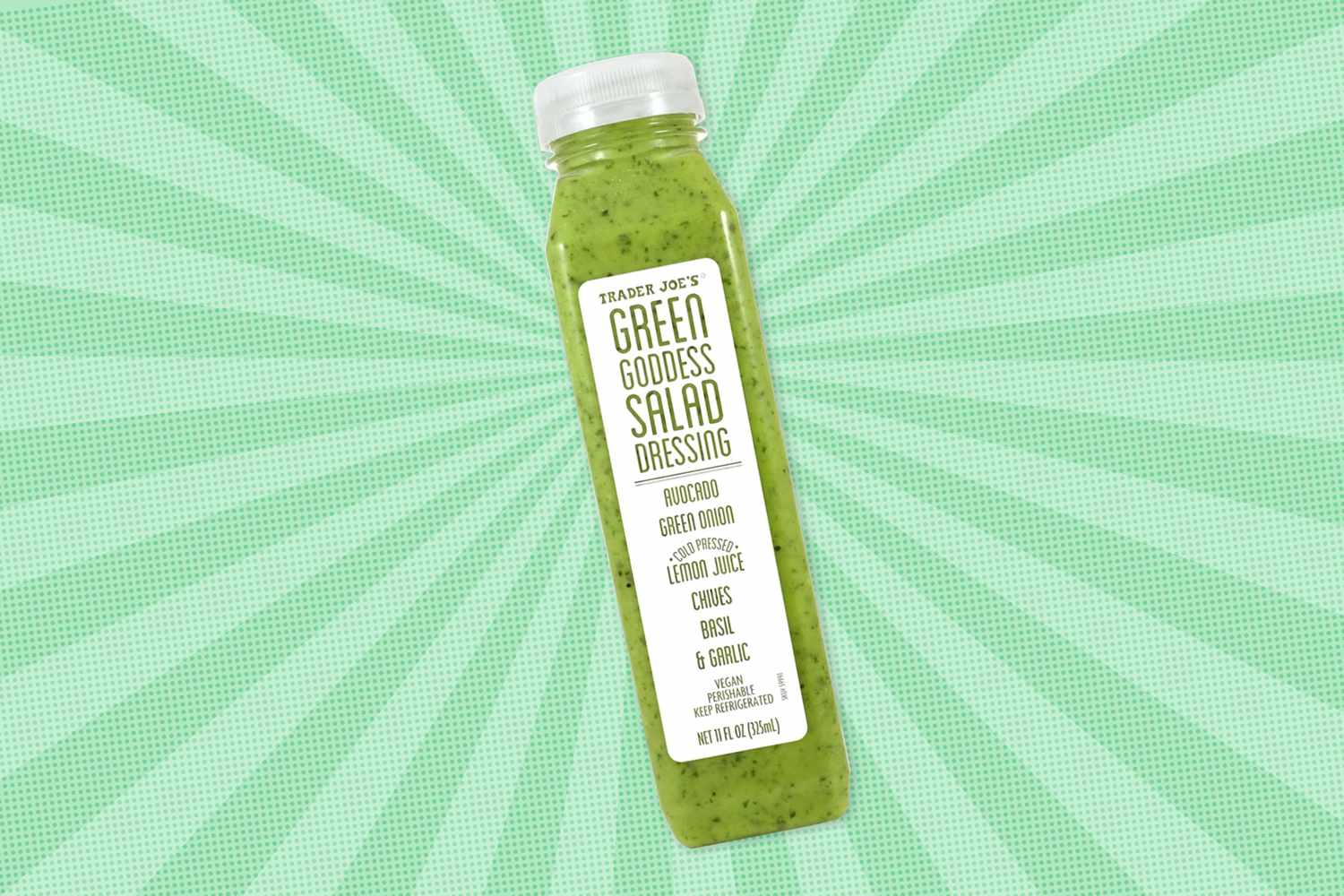 A bottle of Trader Joe's Green Goddess Salad Dressing against a patterned background
