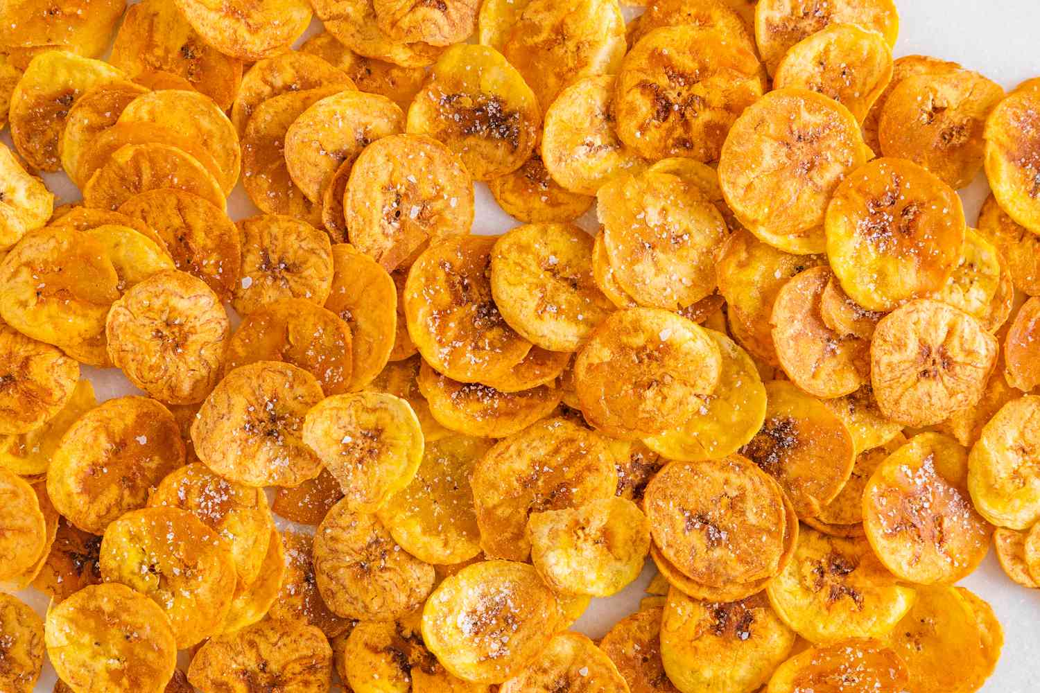 Plantain Chips Topped With Salt on the Counter