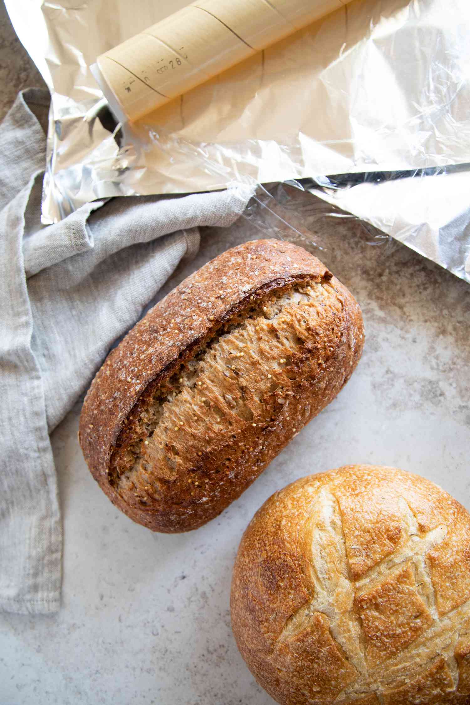 Artisan bread loaves and saran wrap