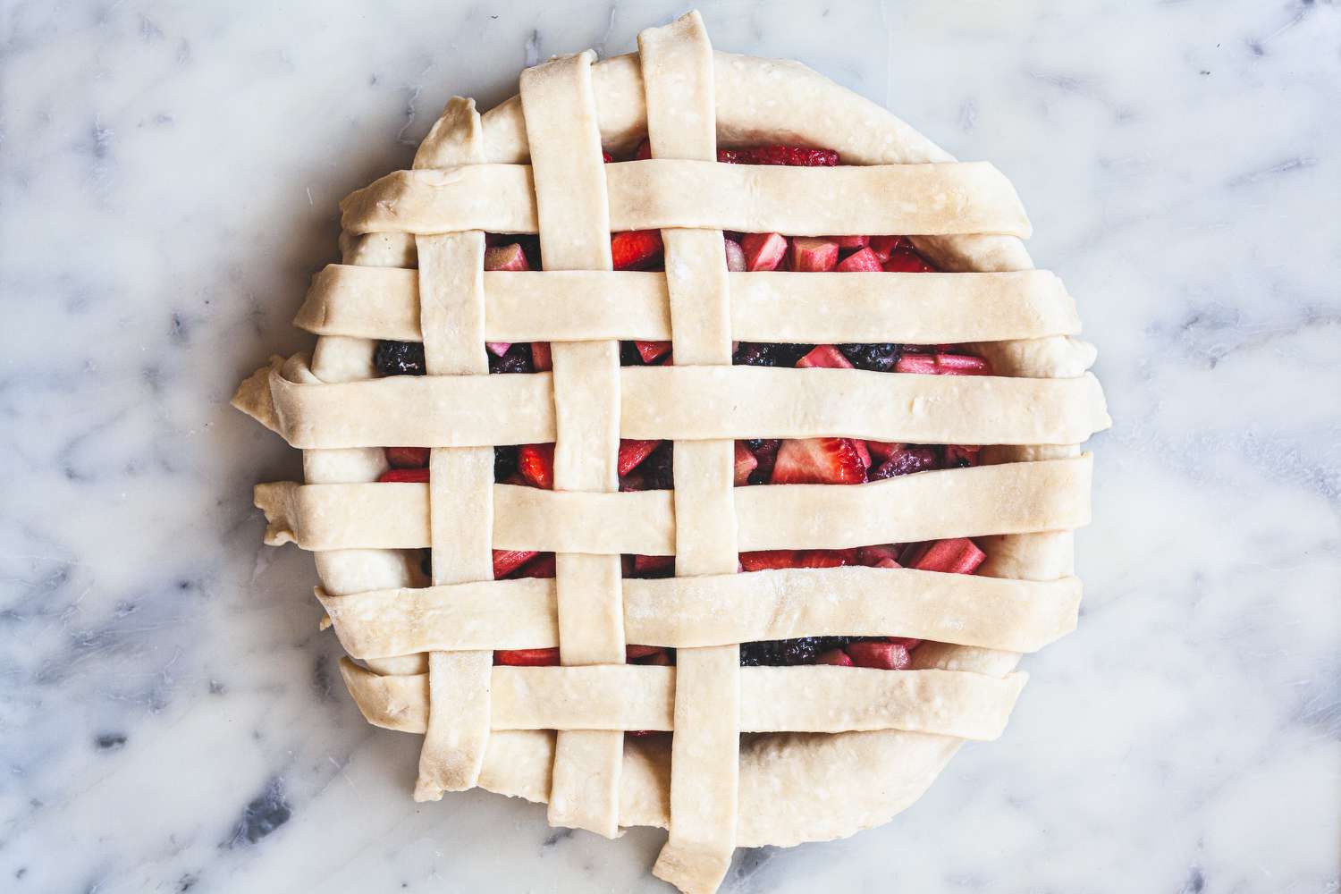 Weaving the strips of a lattice pie crust.