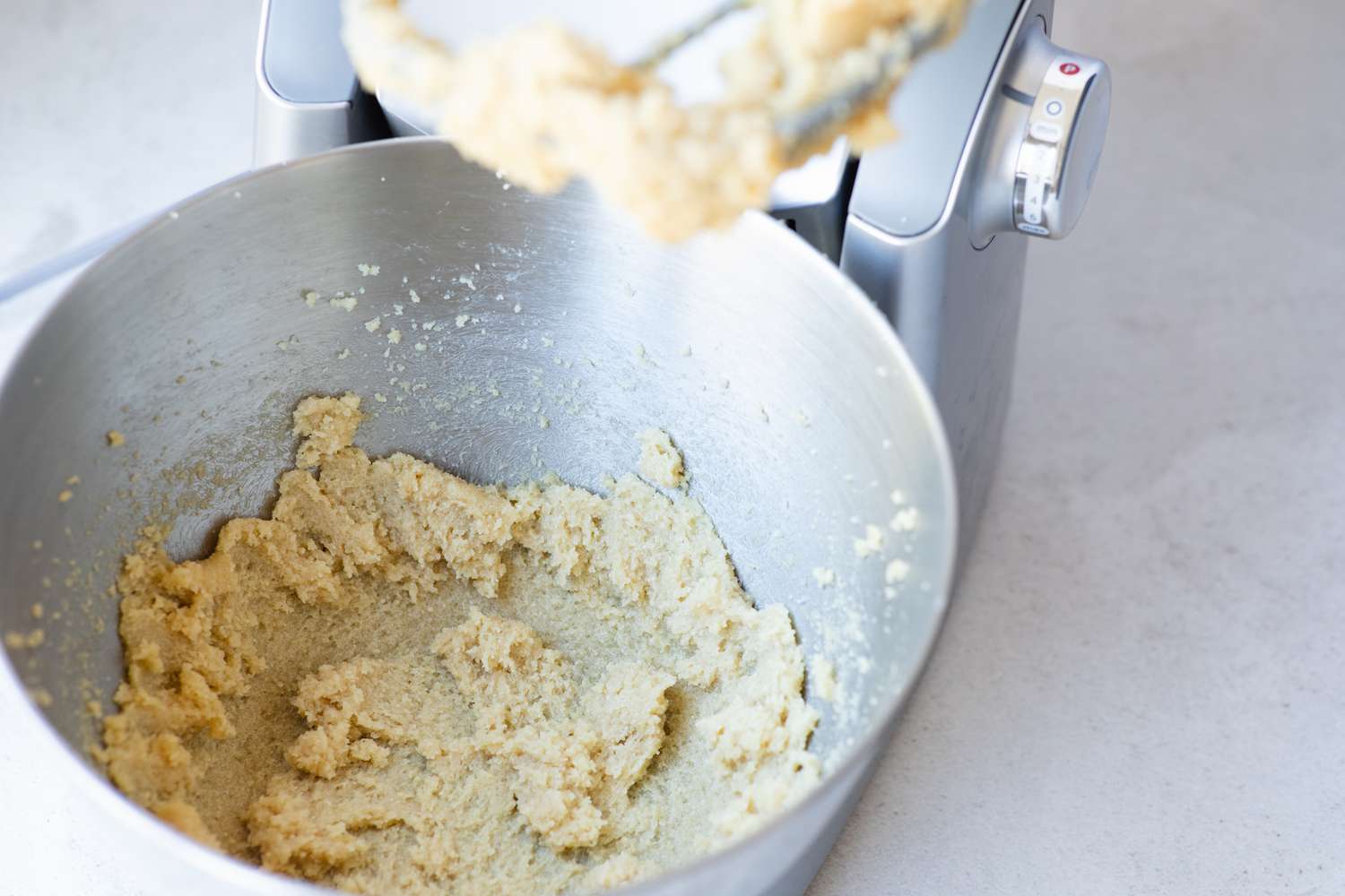 Creaming butter and sugar to make the best red velvet cake recipe