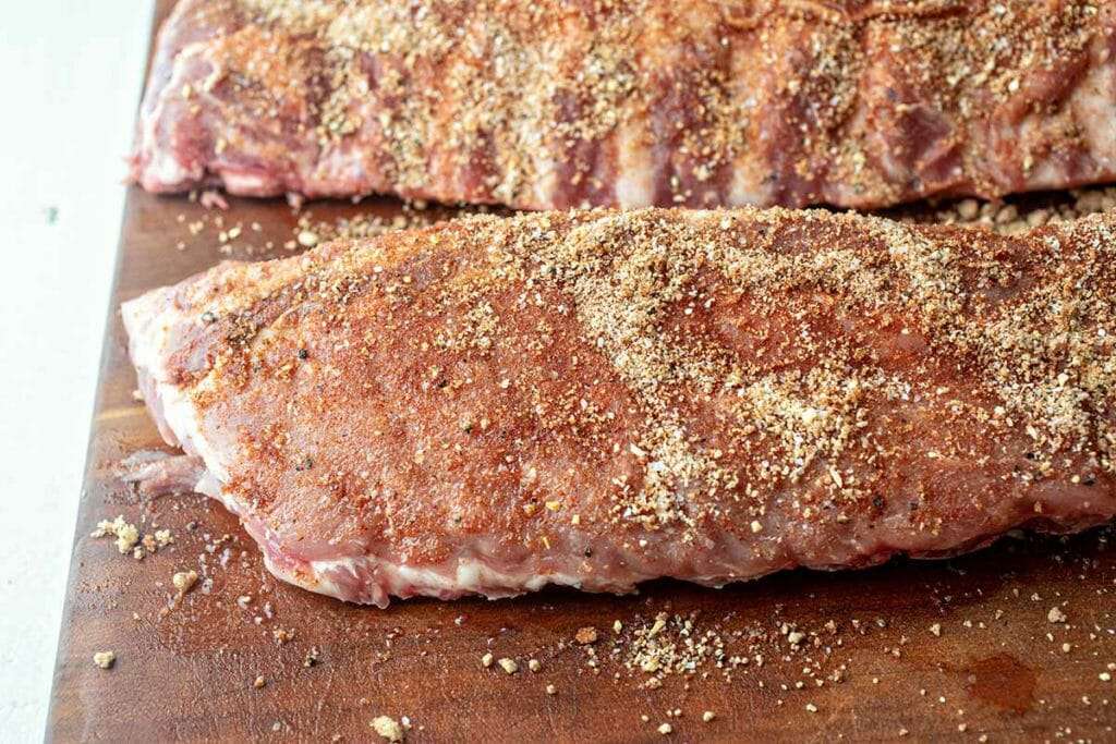 Seasoning Pressure Cooker BBQ Ribs with dry rub