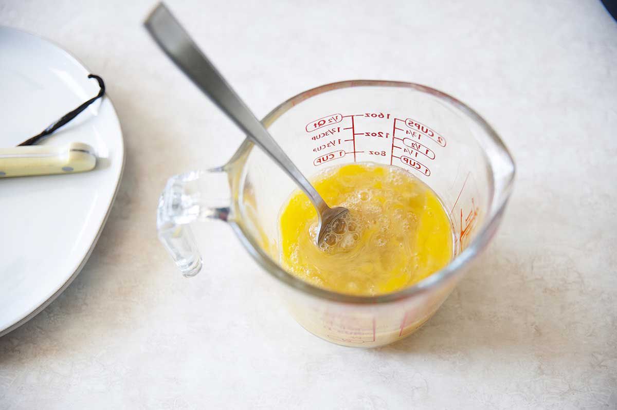 Eggs in a liquid measuring cup.