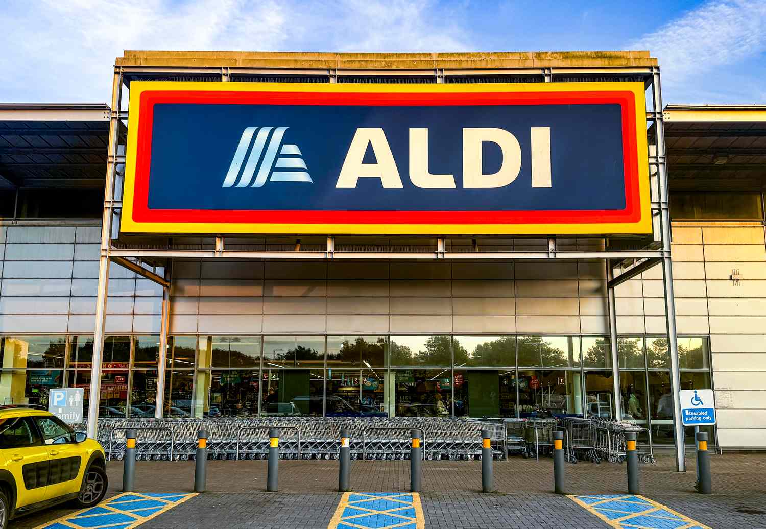 Entrance of an Aldi supermarket with shopping carts visible outside