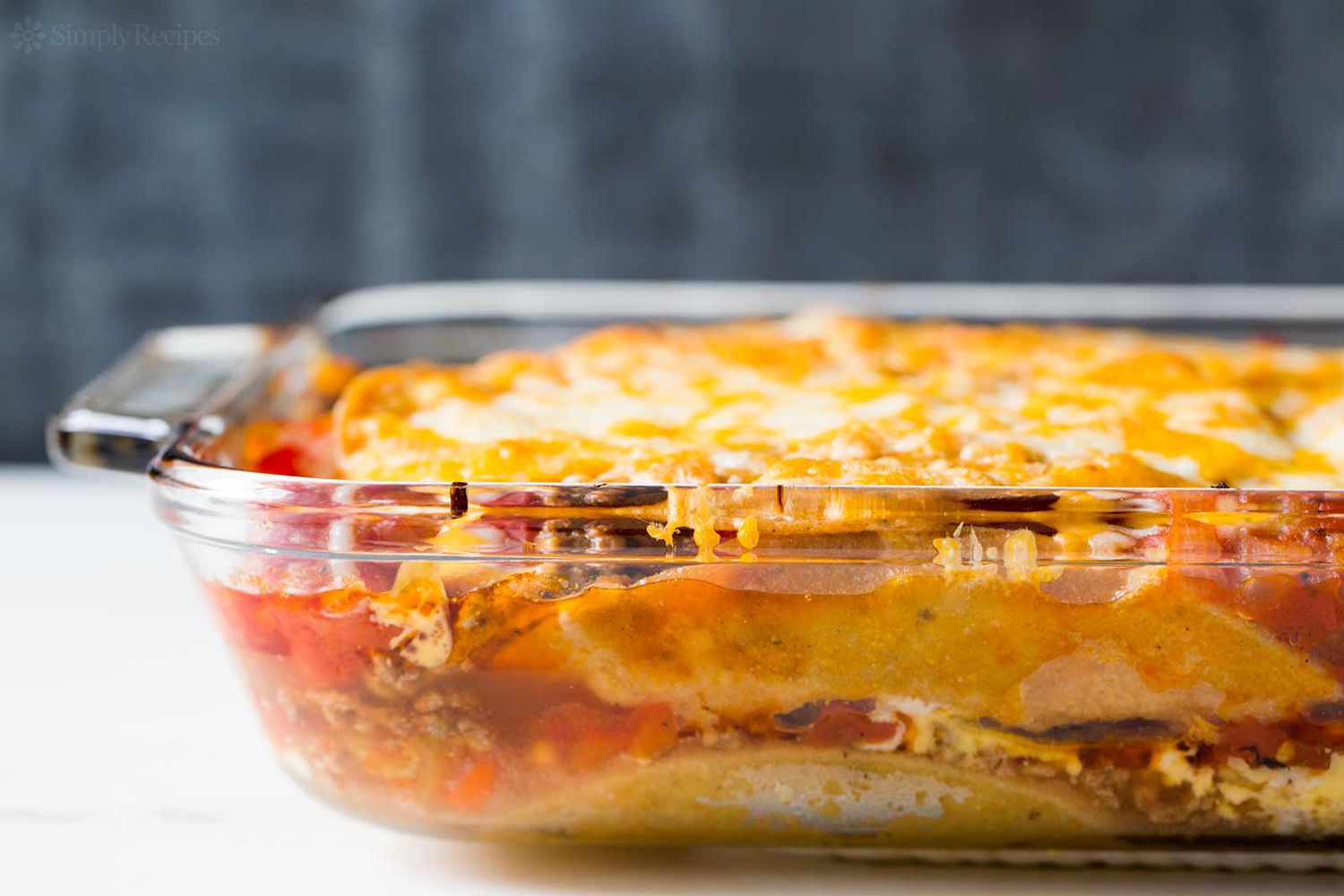 Mexican Lasagna made with tortillas, beef, beans, and cheese ready to serve