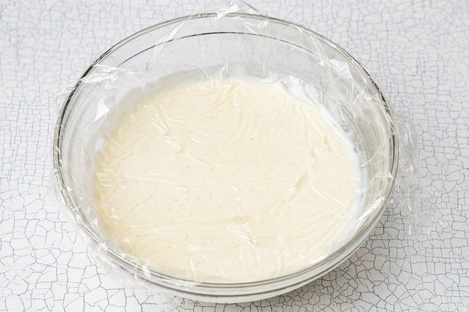 Homemade Vanilla Pudding Covered in Plastic Wrap