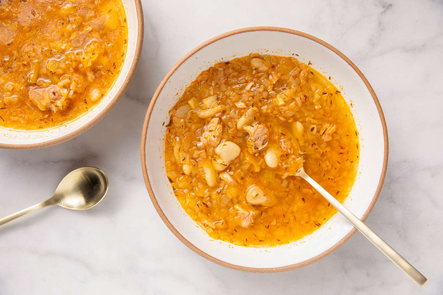 15-Minute Tuna and Butter Bean Stew in a bowl with spoon