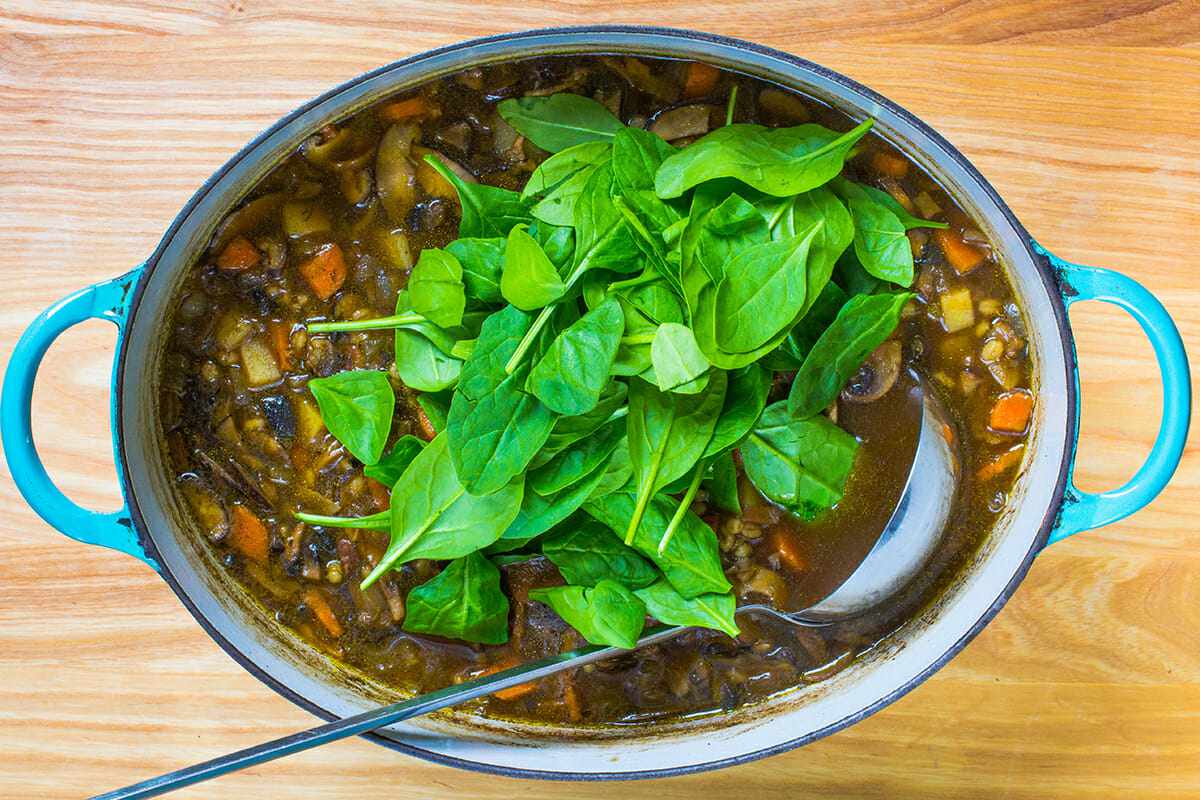 Adding spinach to Vegetarian Mushroom Barley Soup