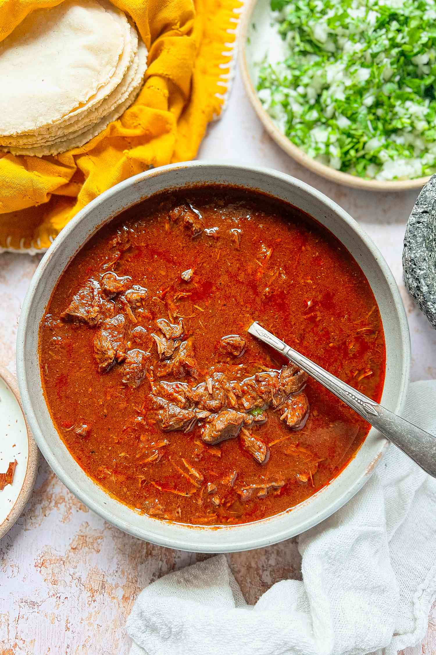 A beef Birria in a white bowl 