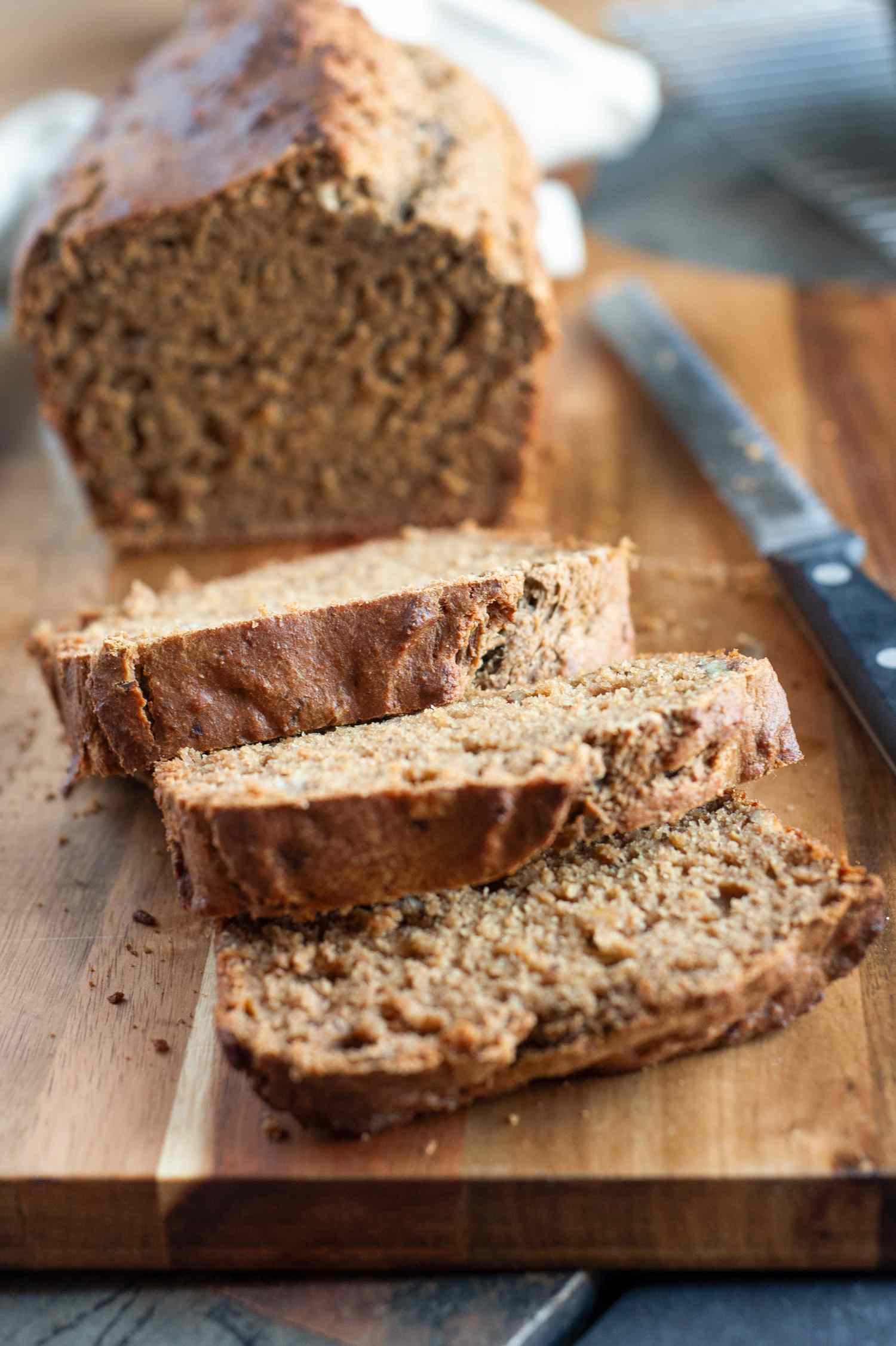 Slices of banana bread on a cutting board.