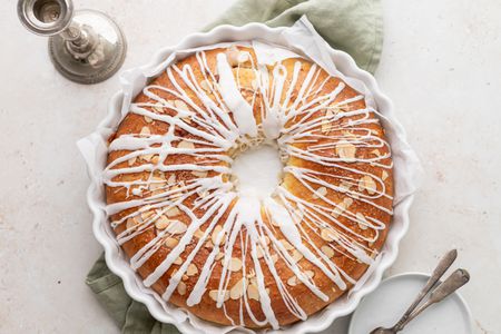 Overhead view of kringle topped with icing.