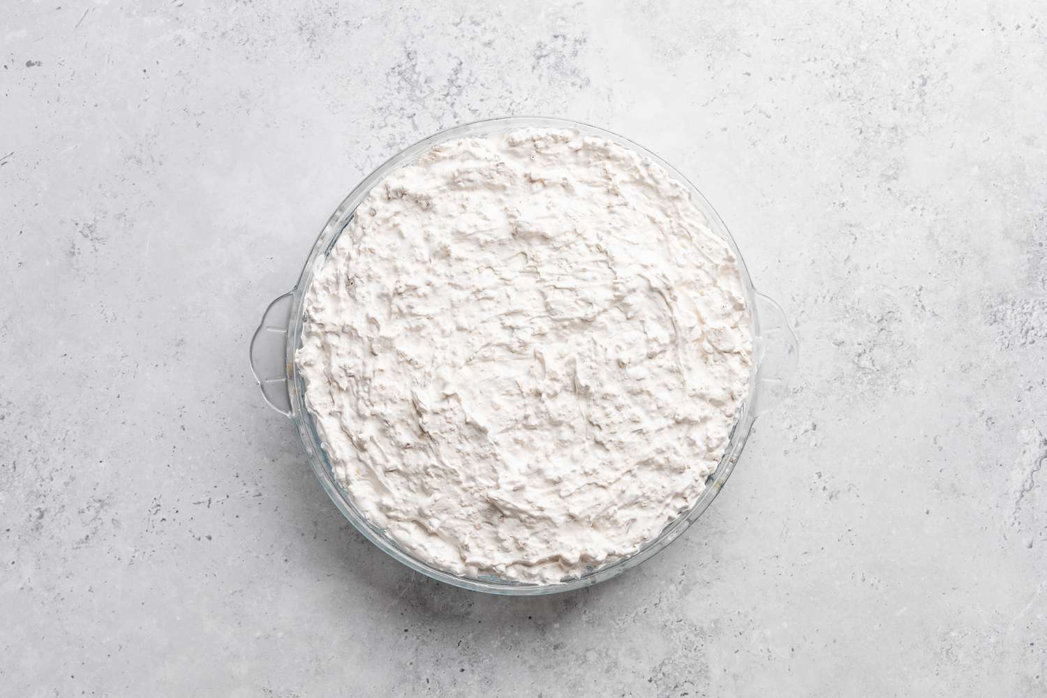 soda cracker pie mixture in a pie dish for soda cracker pie recipe