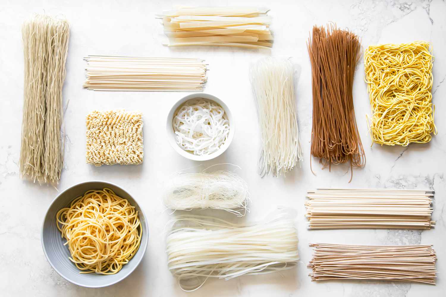 Variety of Asian Noodles on a Counter (Some Dried, Some Cooked) for A Guide to Asian Noodles