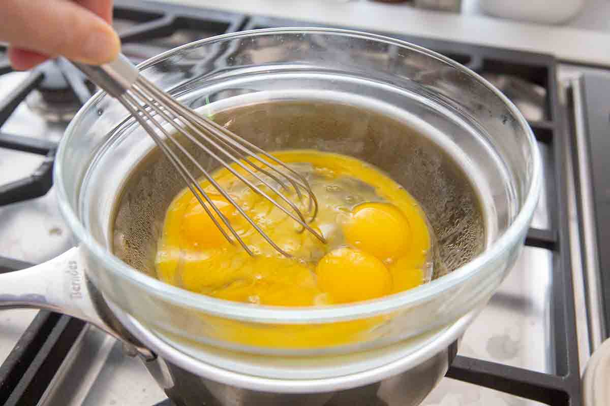 Heat eggs over double boiler