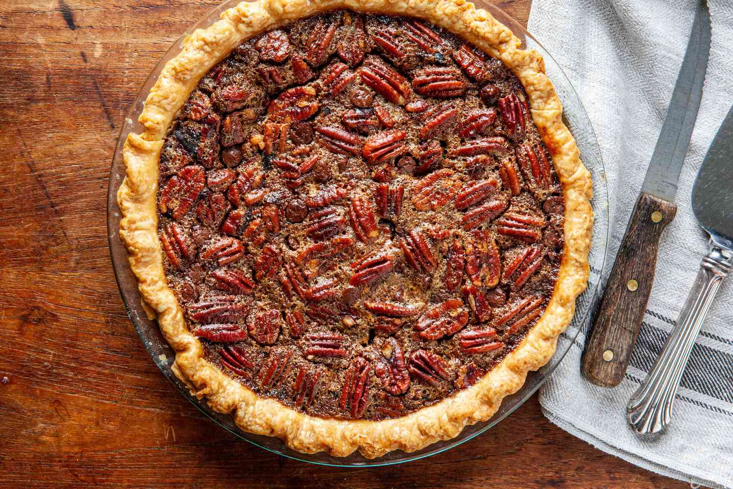 Overhead view of chocolate pecan pie with bourbon.