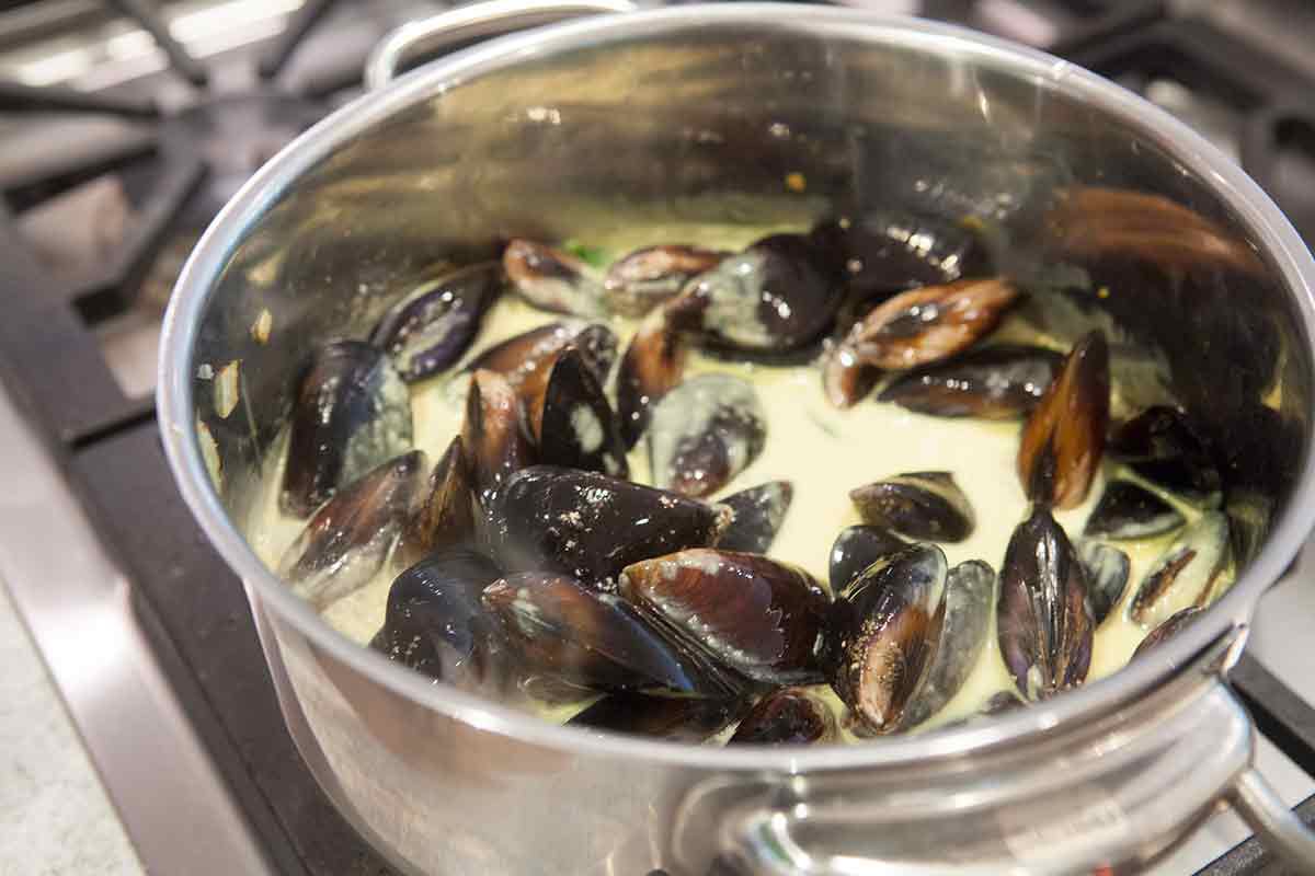 mussels in coconut curry sauce in a pot