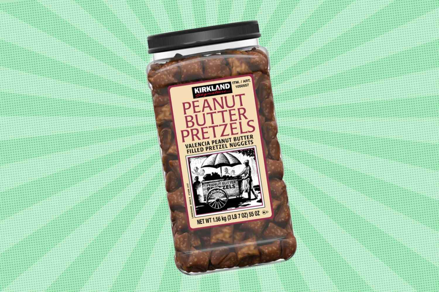 A container of Kirkland Signature peanut butter pretzel nuggets against a green background