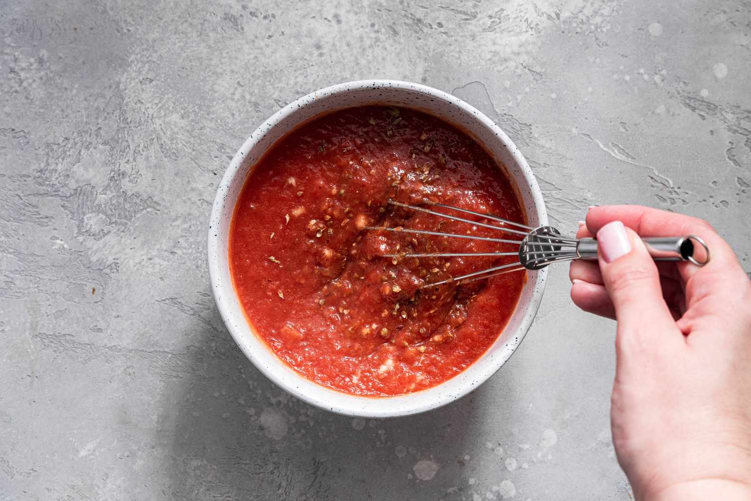 Marinara Sauce Ingredients Whisked Together in a Bowl