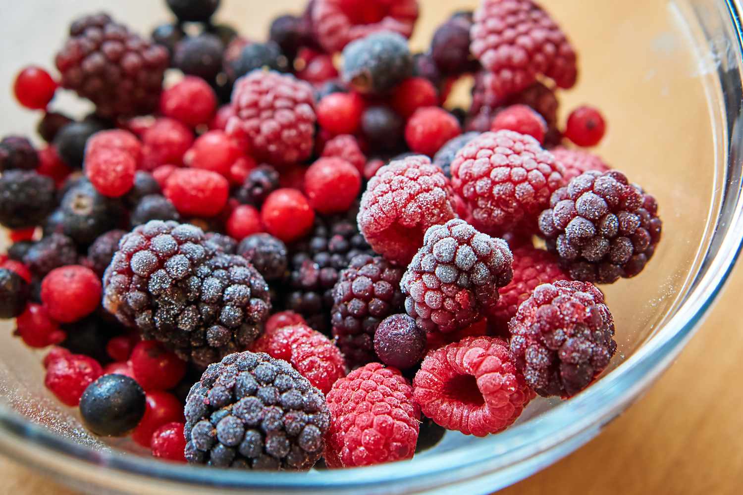 close up of a bowl of frozen mixed berries