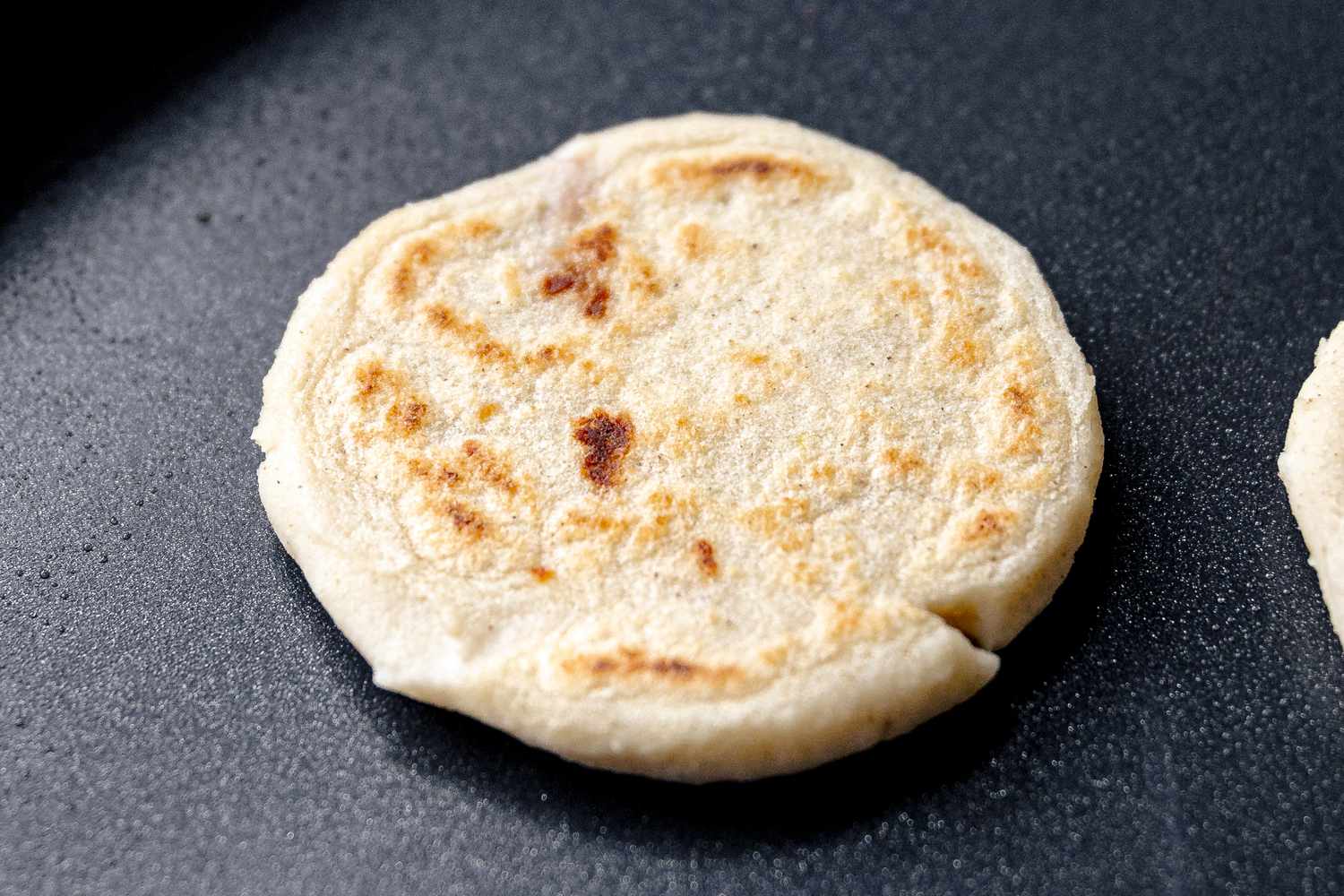 Pupusa Cooking on Griddle