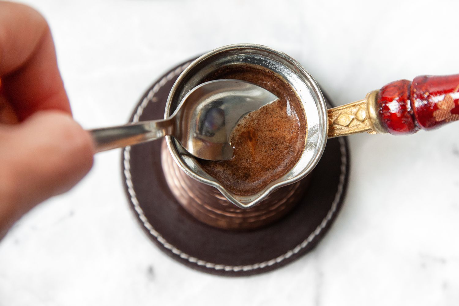 Foam Spooned Out of Cezve for Turkish Coffee 