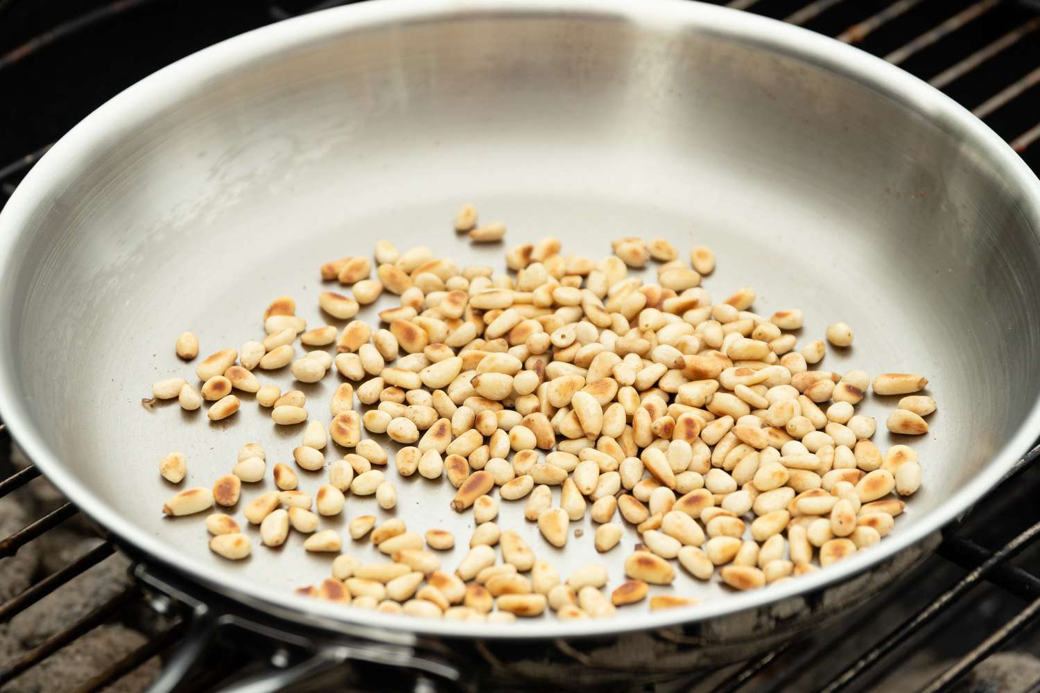 Toast Pine Nuts for Grilled Broccolini with Lemon Tahini Dressing