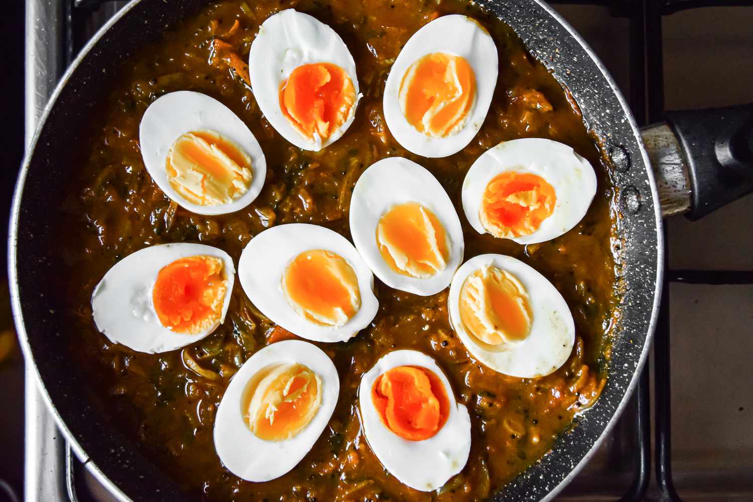 Halved Boiled Eggs Added on Top of Tomato Masala Sauce for Egg Masala Curry