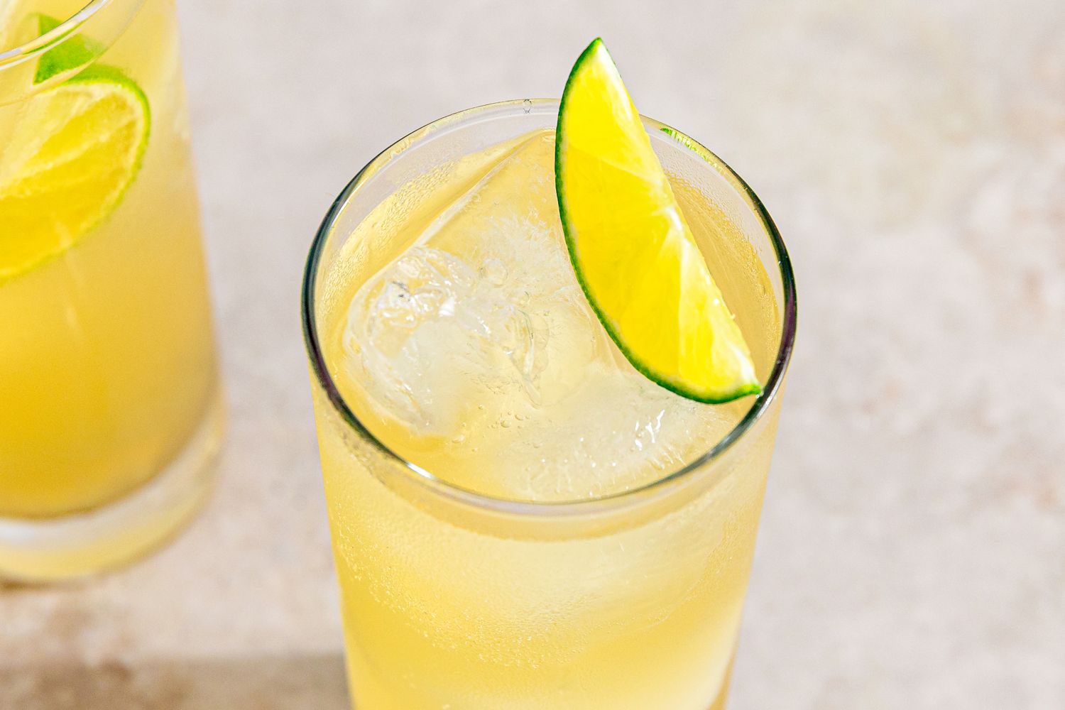 Mezcal Shandy cocktails garnished with lime slices