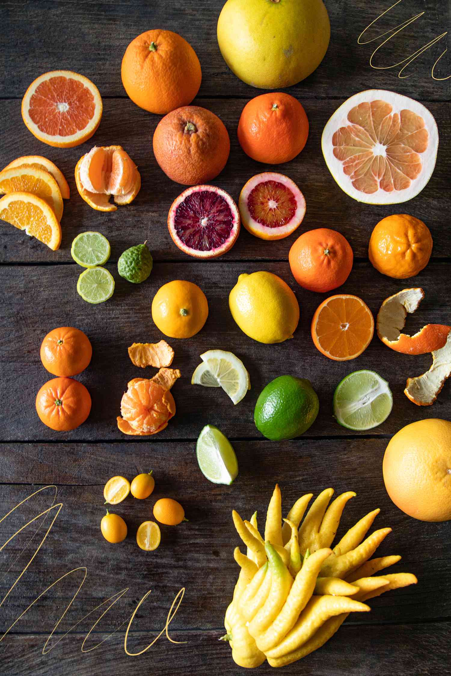 Citrus varieties on dark wood background
