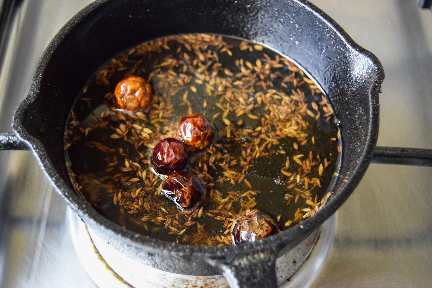 Spices for Tadka Cooking in Ghee in a Small Cast Iron Skillet for Daal Palak
