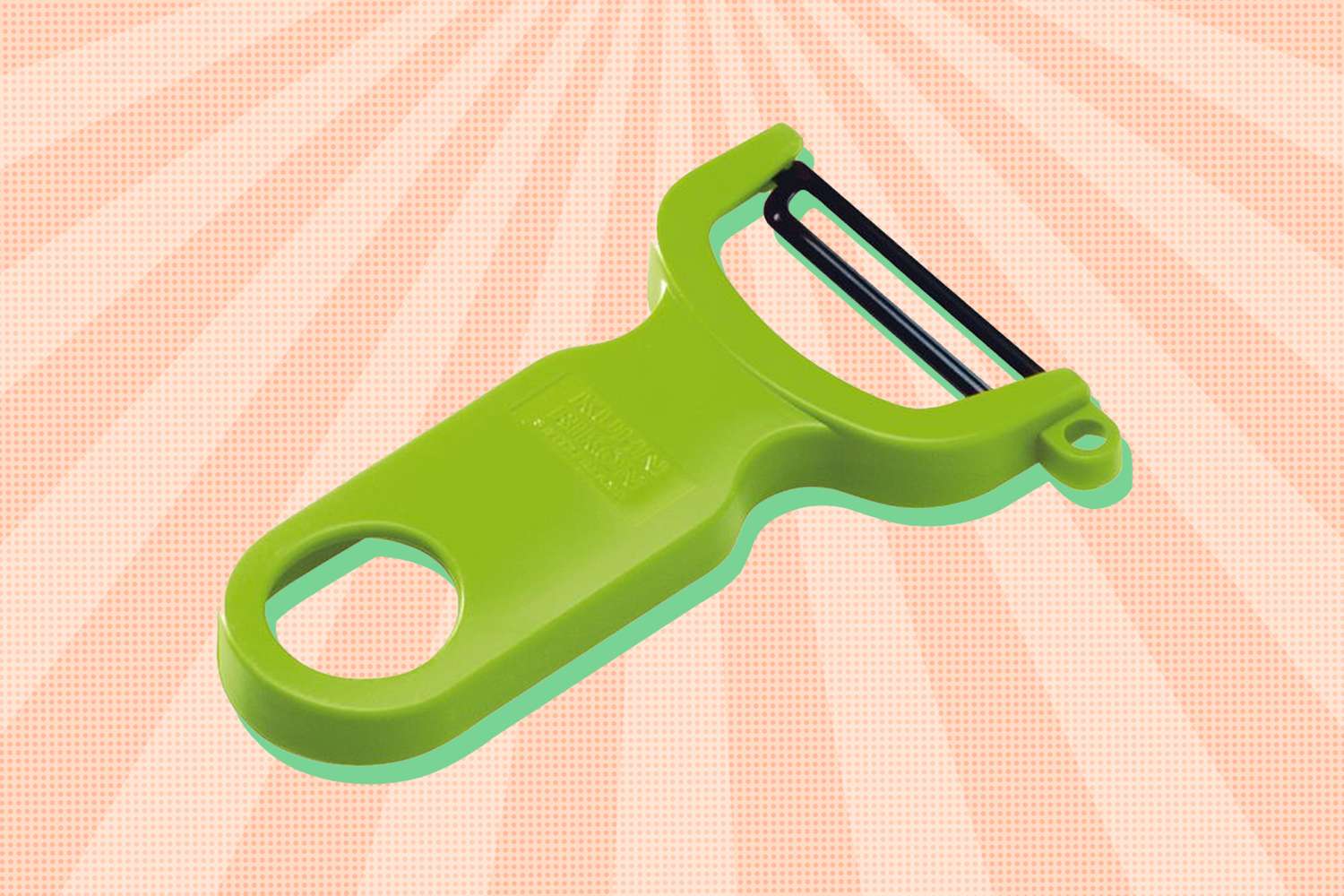 A vegetable peeler with a sturdy green handle displayed against a starburst background