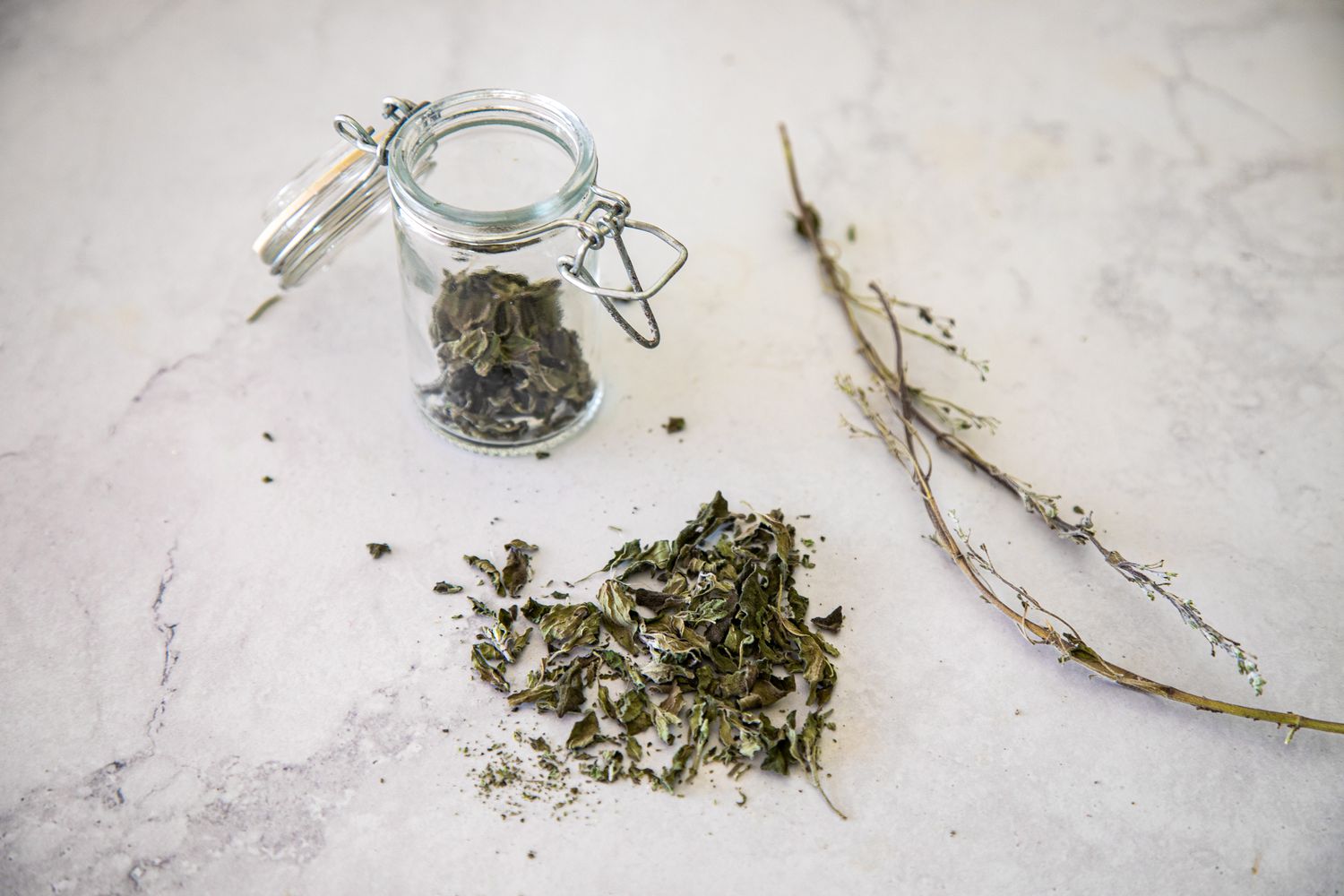 Herbs Removed from their Sprigs, Crumbled, and Stored in a Jar