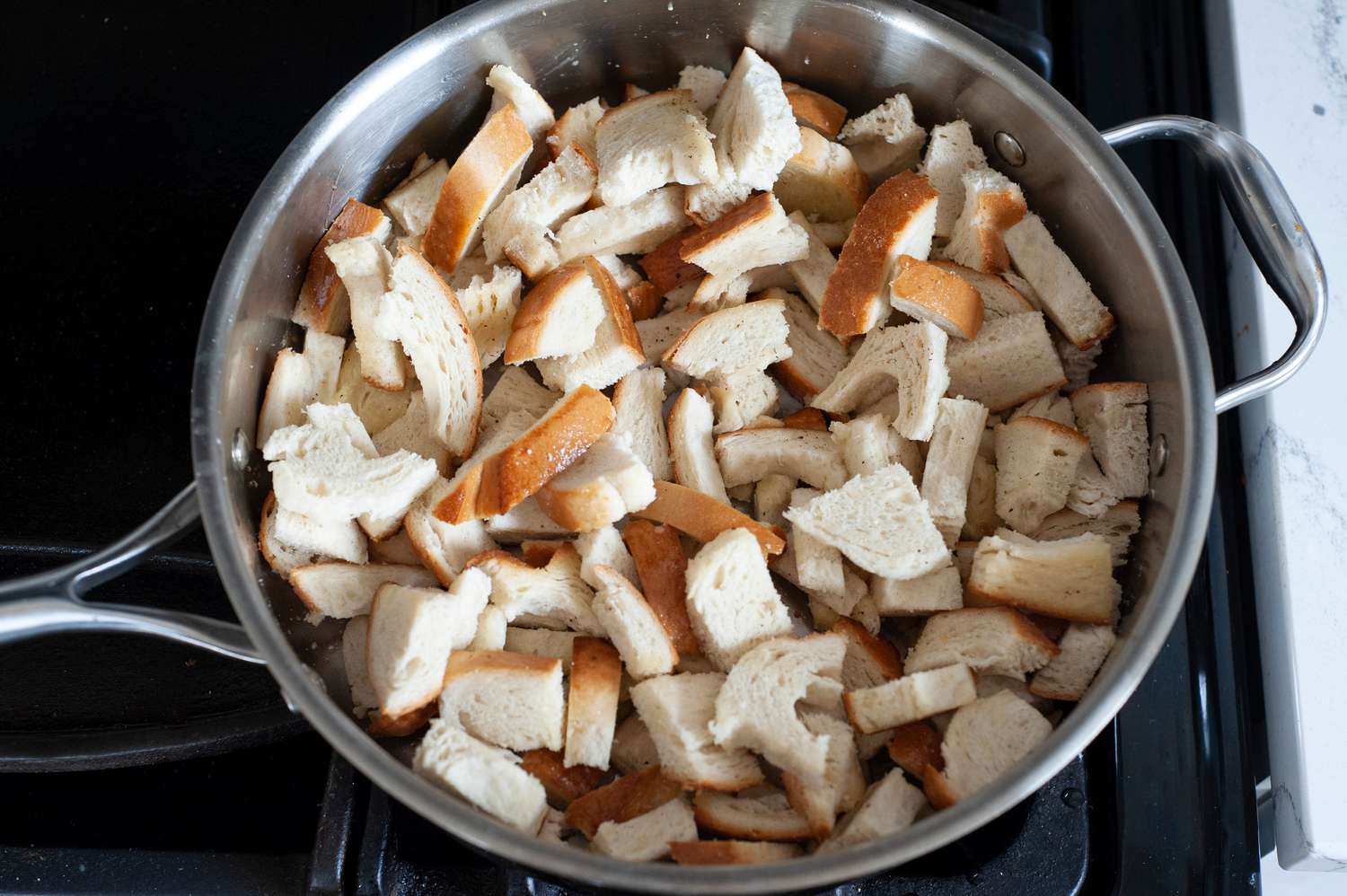 Toast bread in skillet.