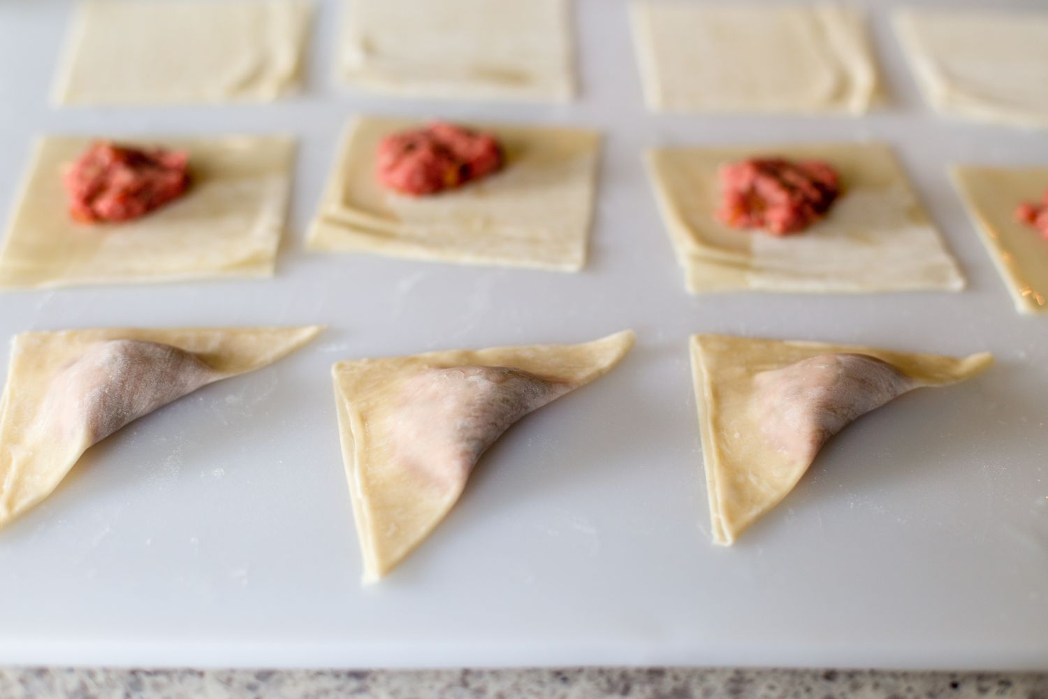 Folding kreplach dumplings 