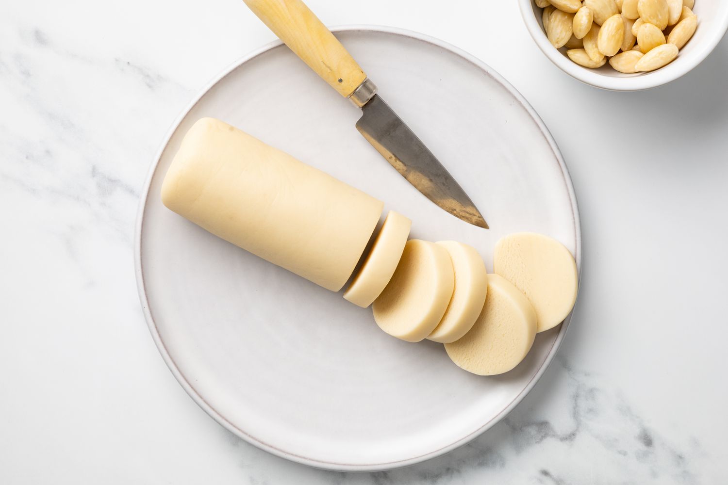 Log of Marzipan with Sliced Marzipan Disks Next to It