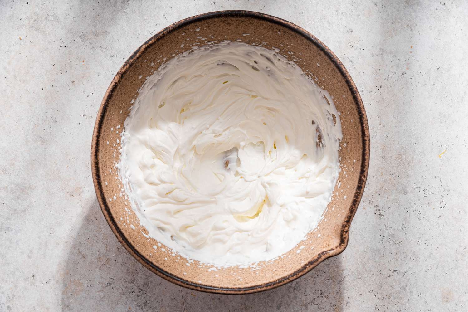 Bowl of whipped cream for no-bake pumpkin pie recipe