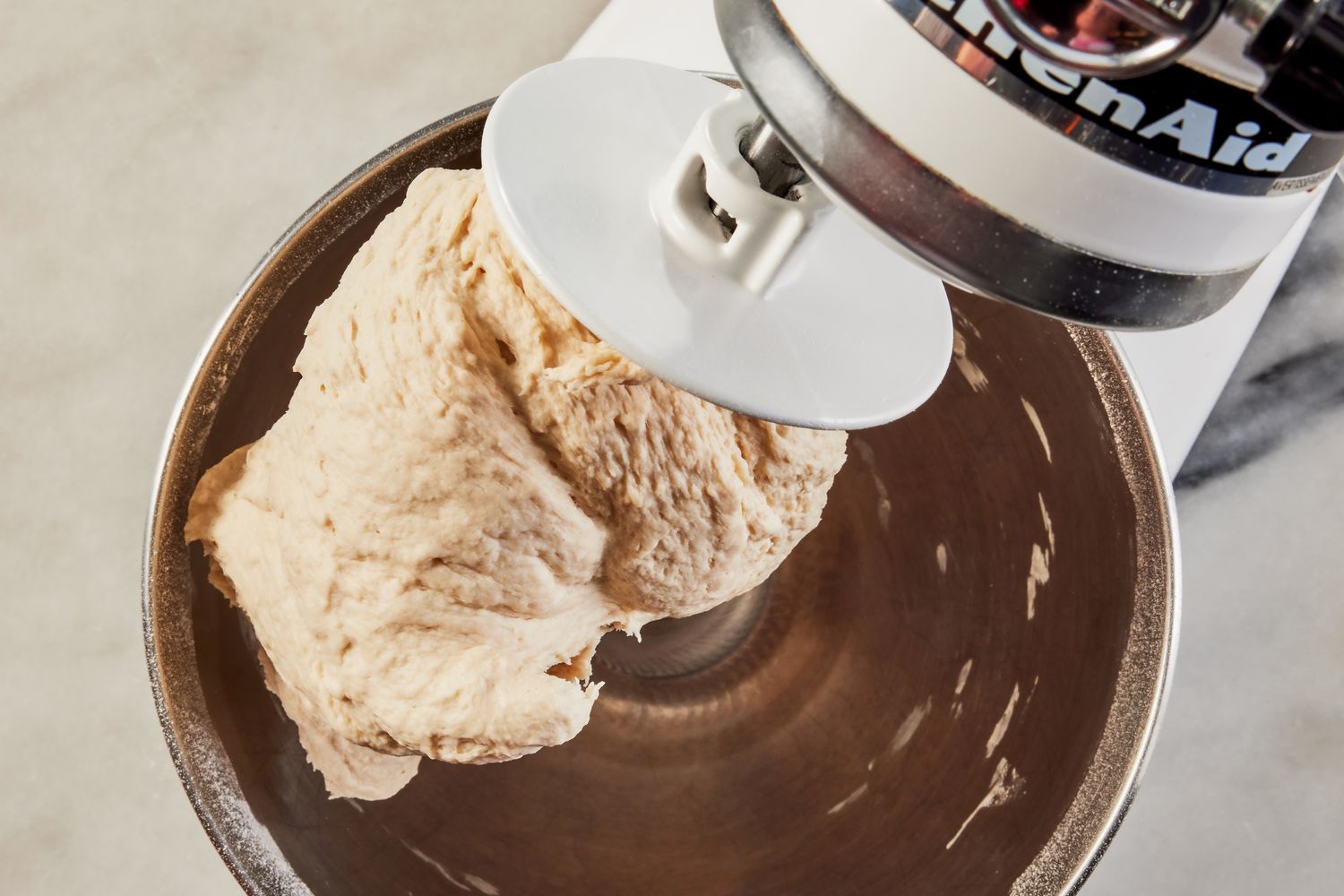 grandma pizza dough in a stand mixer bowl for grandma pizza recipe 