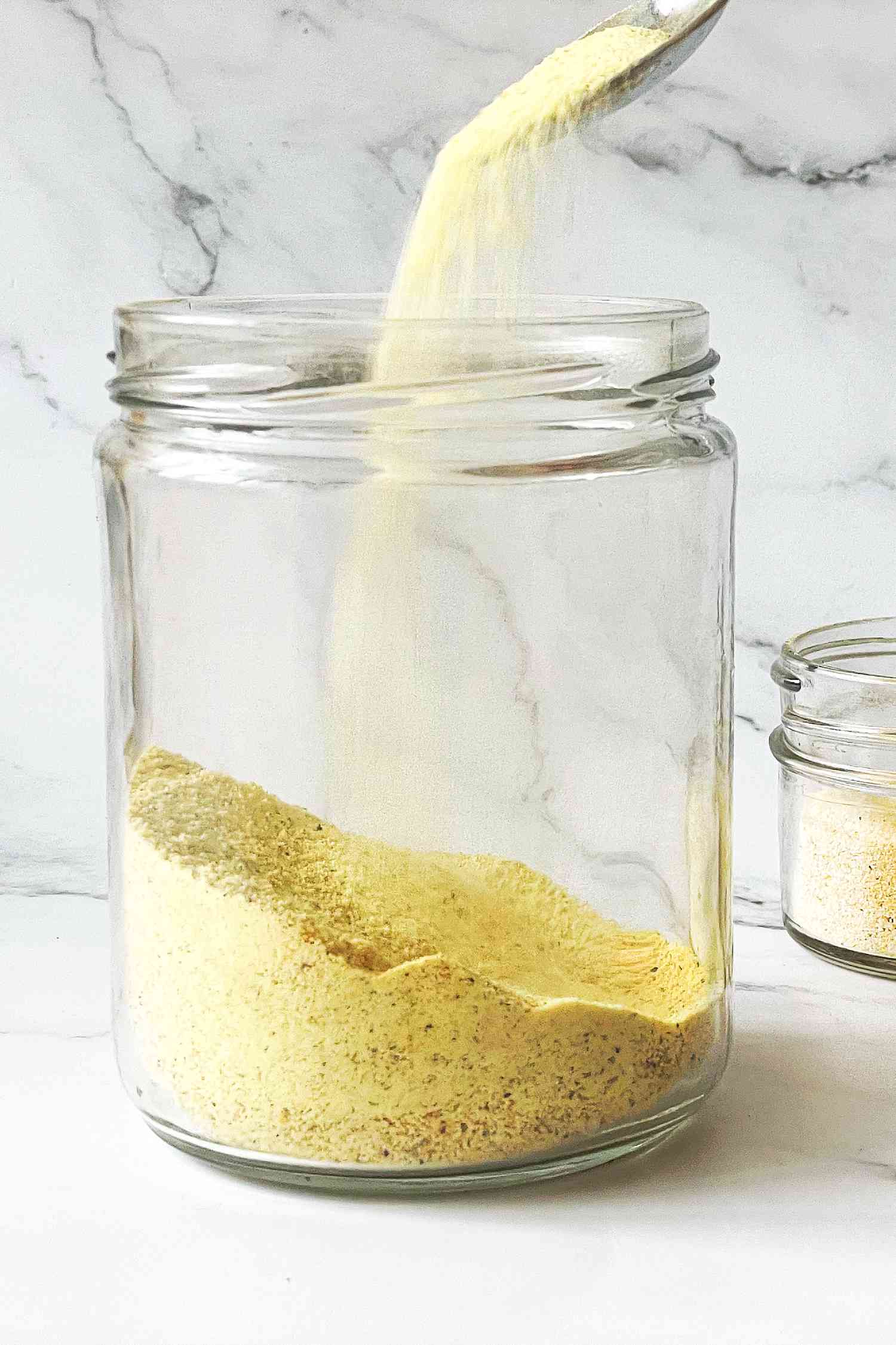 Homemade adobo seasoning in clear jar