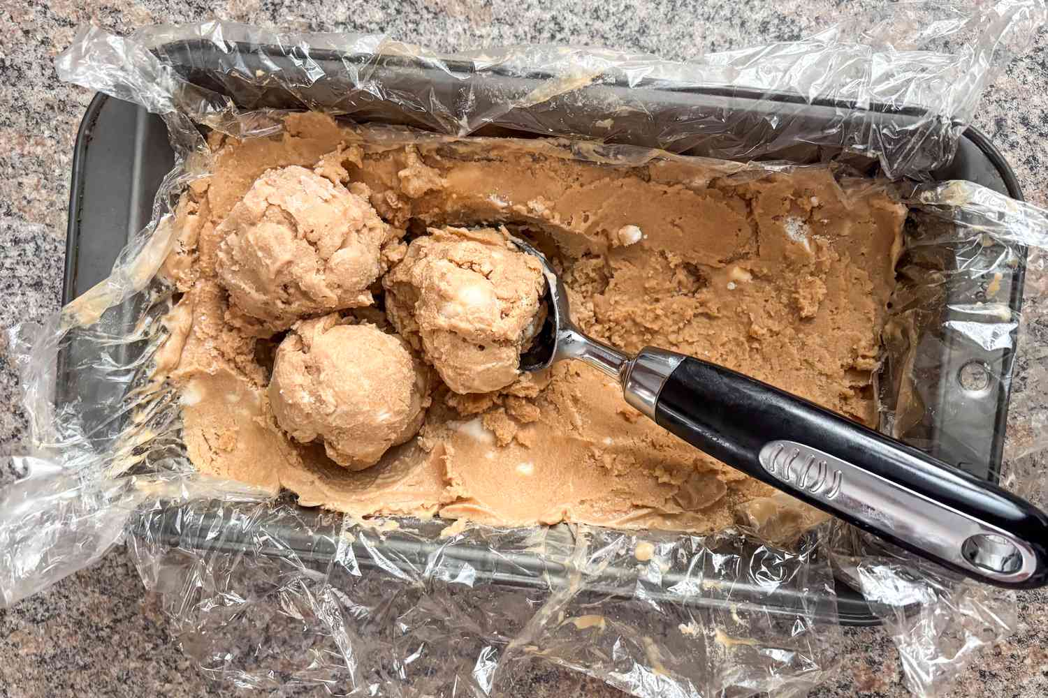 Ice cream scoops being served from a loaf pan