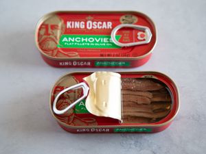 Can of King Oscar anchovies, one open and one sealed
