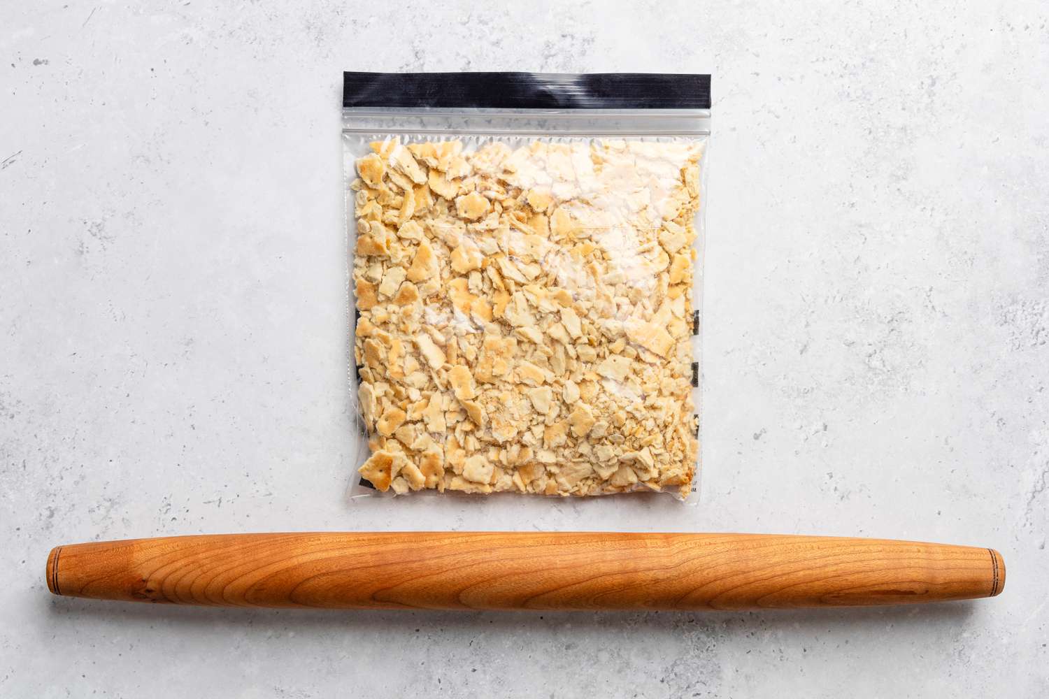 saltine crackers crushed in a ziploc bag for soda cracker pie recipe