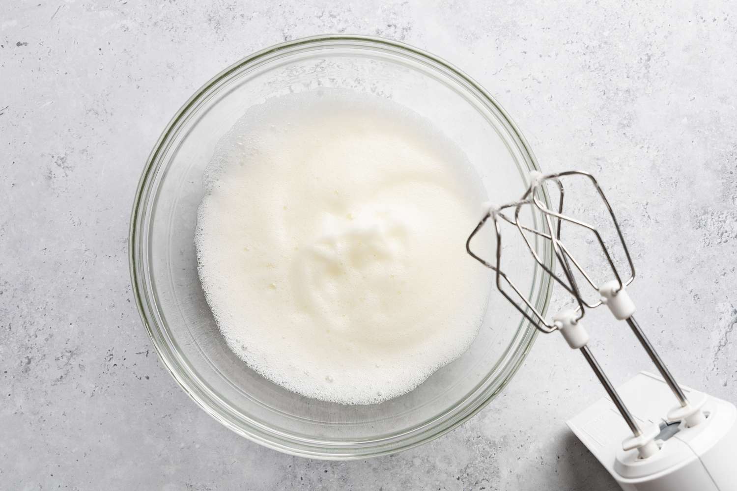 egg whites whipped to soft peaks in a bowl for soda cracker pie recipe