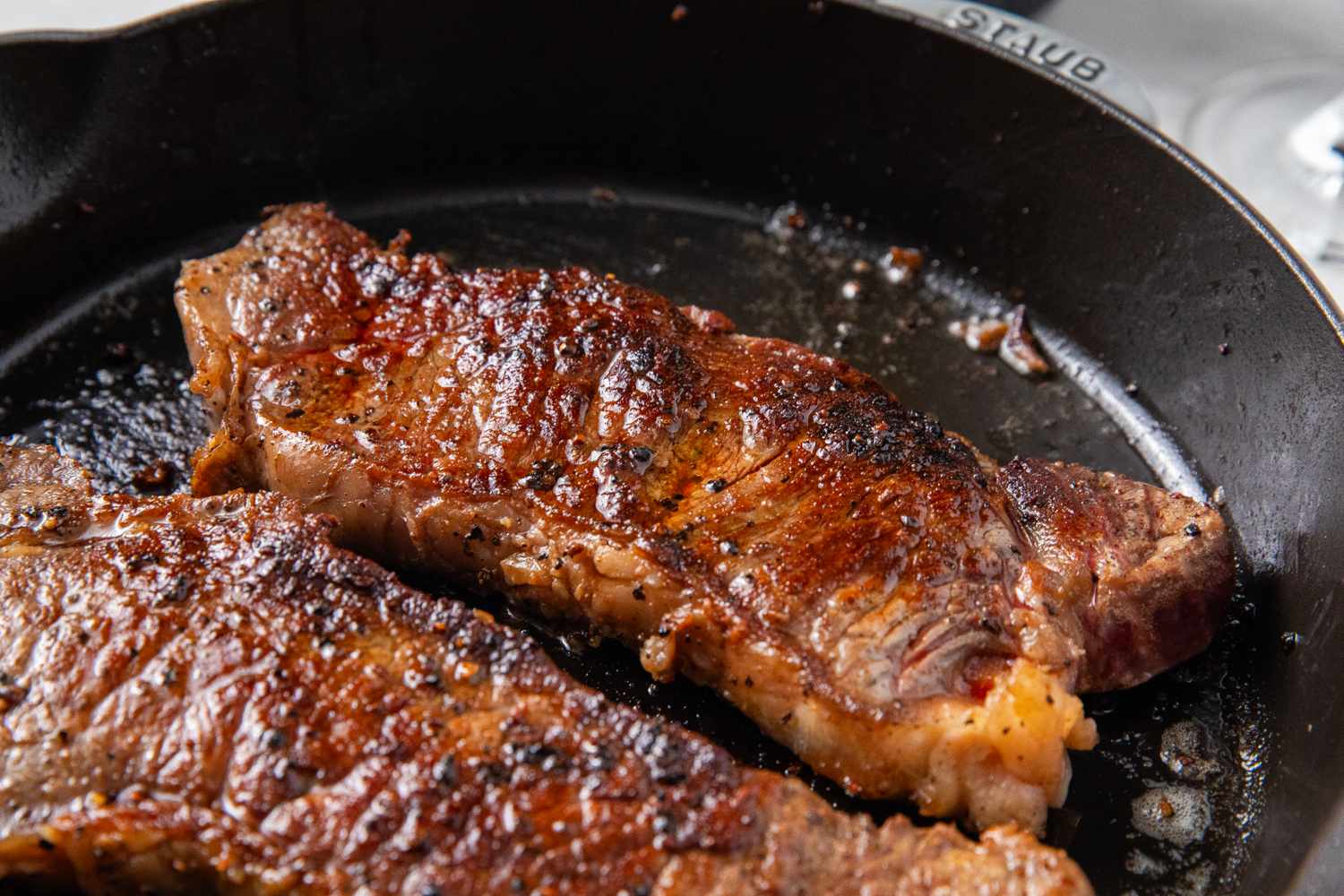 Cooked steaks in a skillet