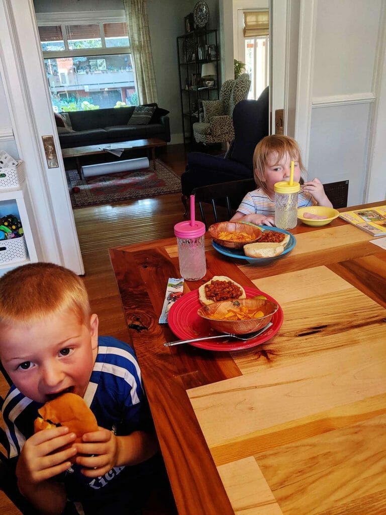 Kids eating vegan sloppy joes with lentils