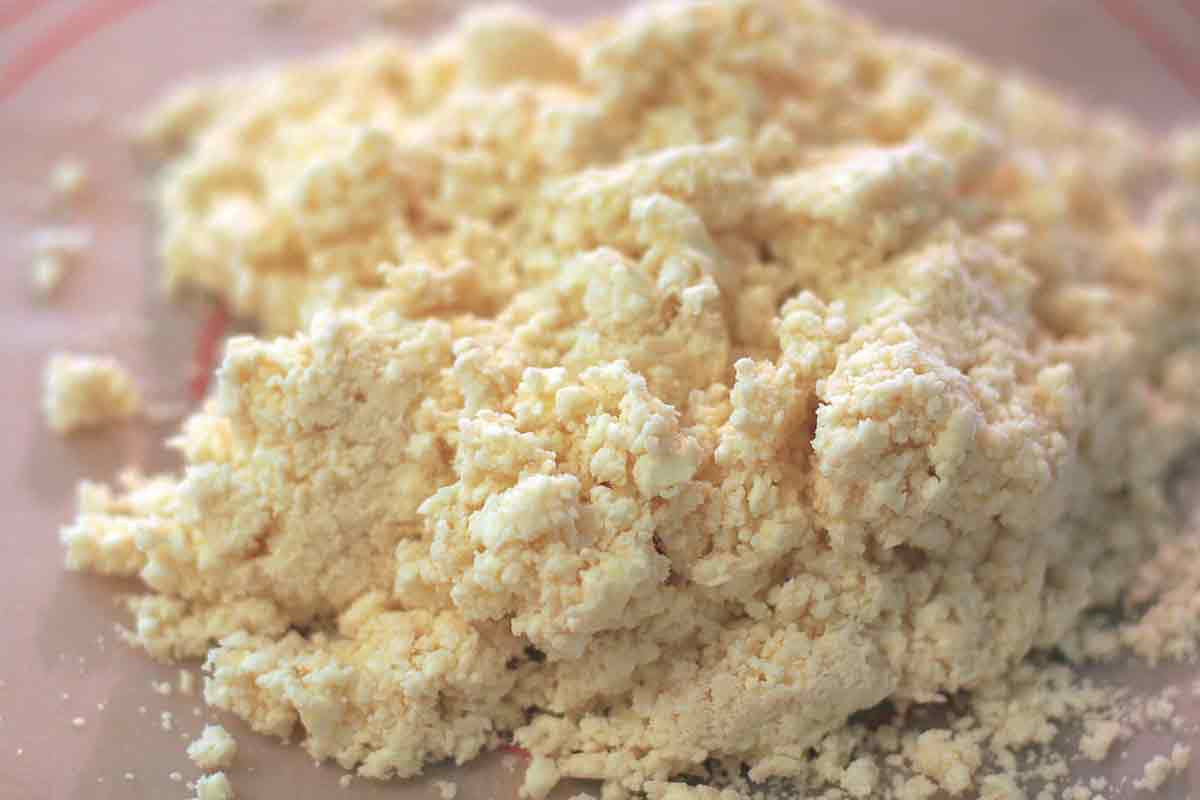 Shaggy dough on a counter to top a chicken pot pie.