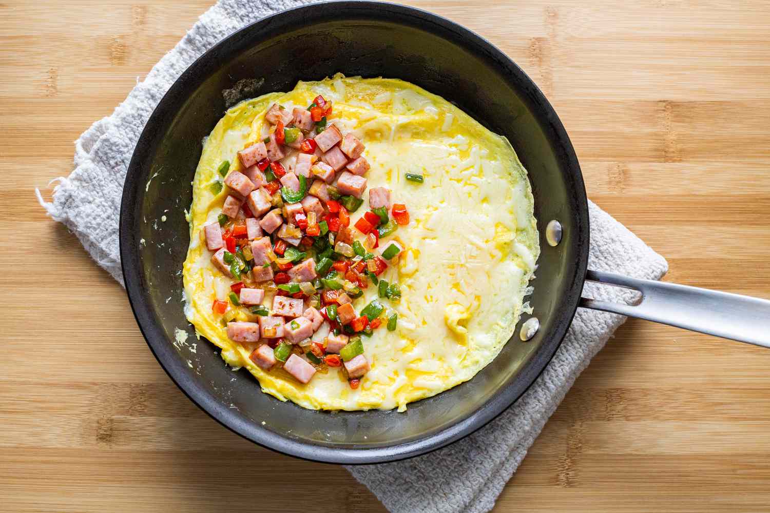 Vegetables and Ham in Denver Omelet on Pan 