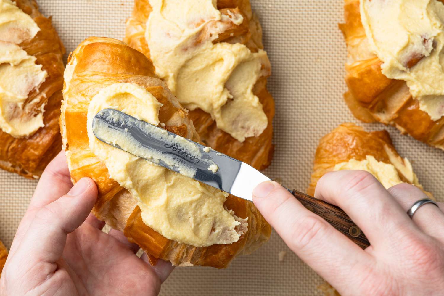 Frangipane Spread Onto the Top of the Croissants Using an Offset Spatula