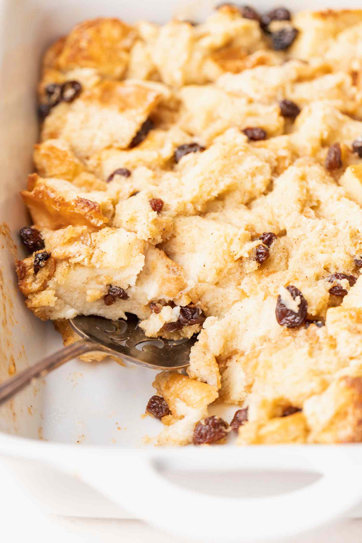 Overhead view of a casserole dish with bread pudding inside.