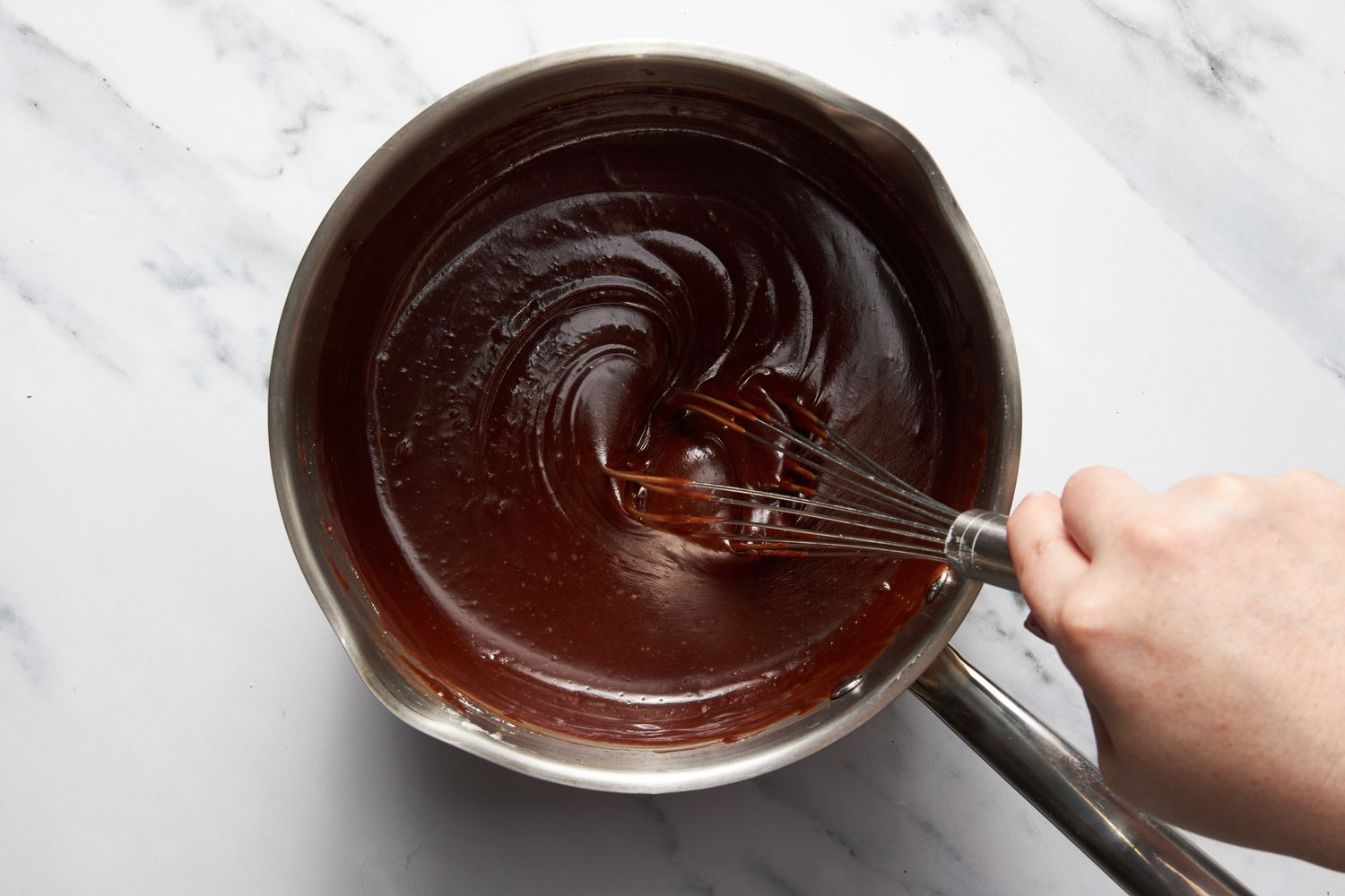 Bumpy cake chocolate fudge whisked together in the sauce pan off the stove 